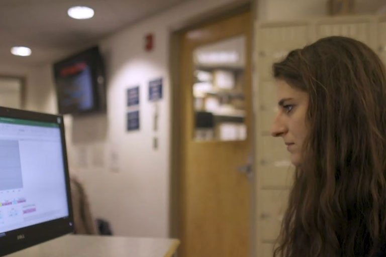 student sitting at computer working