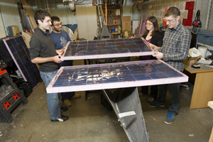 A team of seniors in the College of Engineering designed and constructed solar panels for the solar-boat team to use in competition. Photo by Brooks Canaday