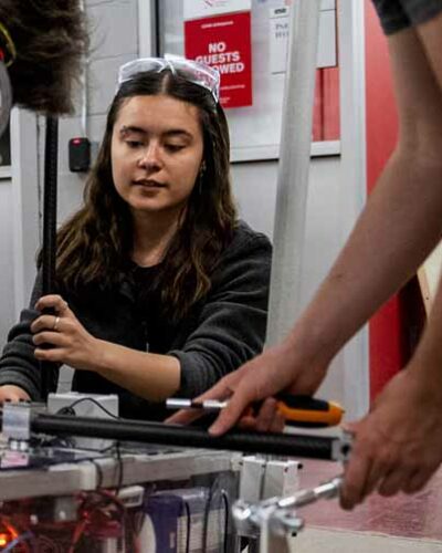 student working on mechanical capstone project