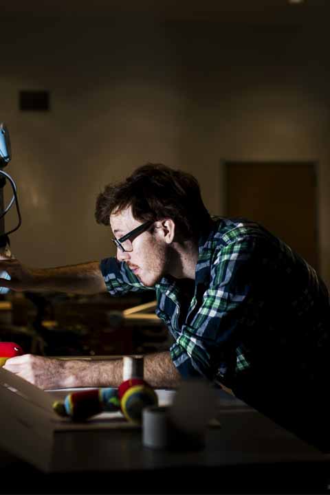 student working on mechanical device